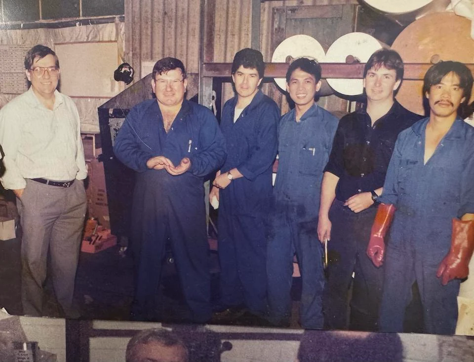 Six members of the PPC manufacturing team standing together inside the factory